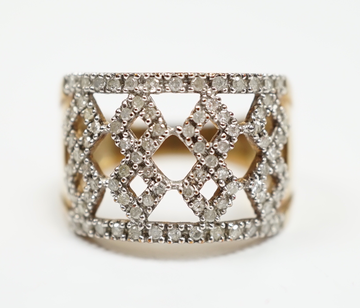A modern 9ct gold and diamond chip cluster set dress ring, size P, gross weight 4.8 grams.